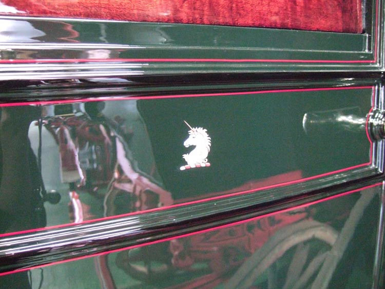 unicorn on side of carriage